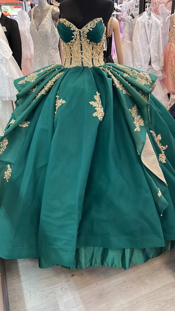 Only available in size 14. Beautiful & elegant Emerald-Green with Gold underside and Three-dimensional Floral Embroidered Gown.